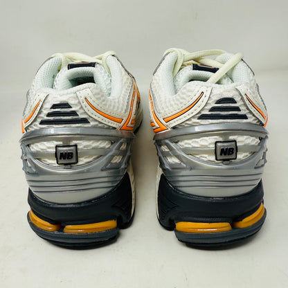 New Balance 1906R ASOS Exclusive Neon Pack in orange on display box.