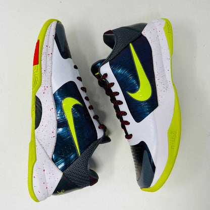 The Nike Kobe 5 Protro Chaos sneaker, authentic and vibrant, is showcased on a black shoe box. It features a bright lime green Nike swoosh, purple and white accents, a speckled pink midsole, red-speckled laces, and a textured gray heel.