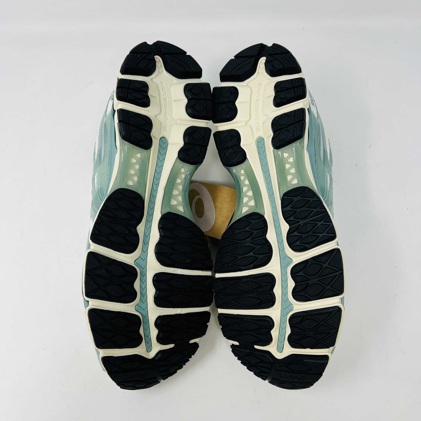 The ASICS Gel-Kayano 12.1 Kith Cream Sage sneakers in pastel green and white feature a breathable mesh design. Theyre accompanied by two packs of extra laces (green and white with black speckles), offering versatile styling for your 100% authentic needs.