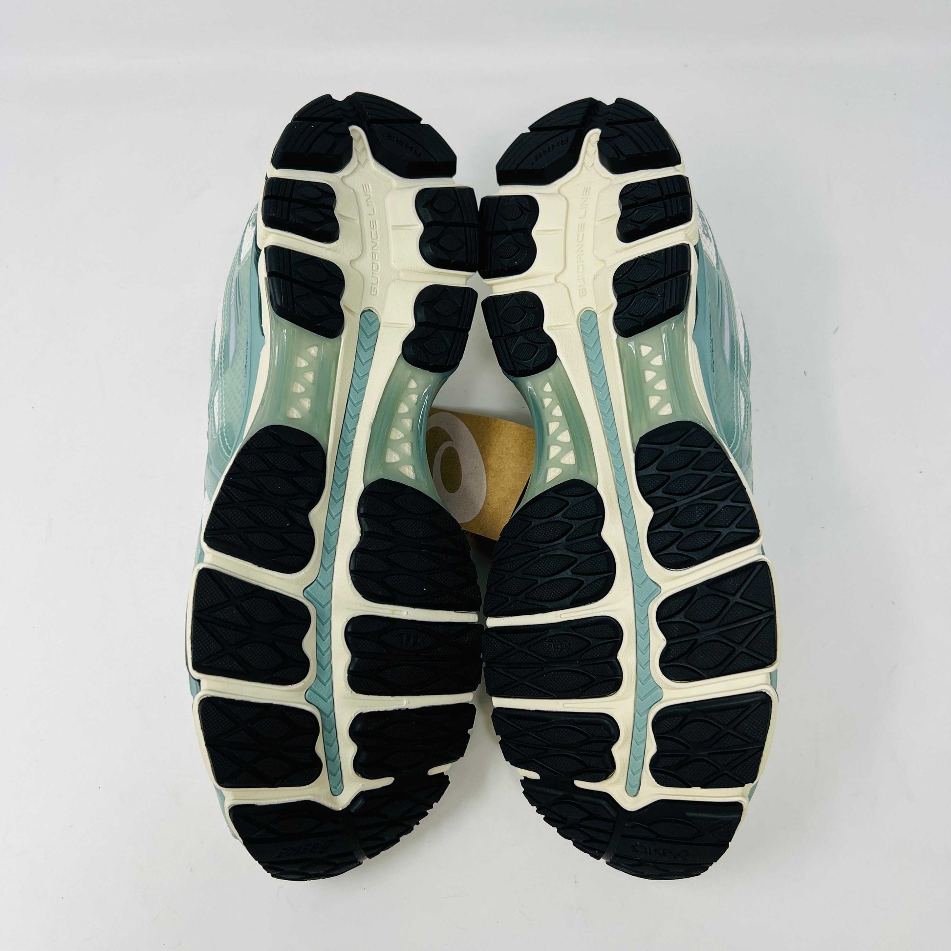 The ASICS Gel-Kayano 12.1 Kith Cream Sage sneakers in pastel green and white feature a breathable mesh design. Theyre accompanied by two packs of extra laces (green and white with black speckles), offering versatile styling for your 100% authentic needs.