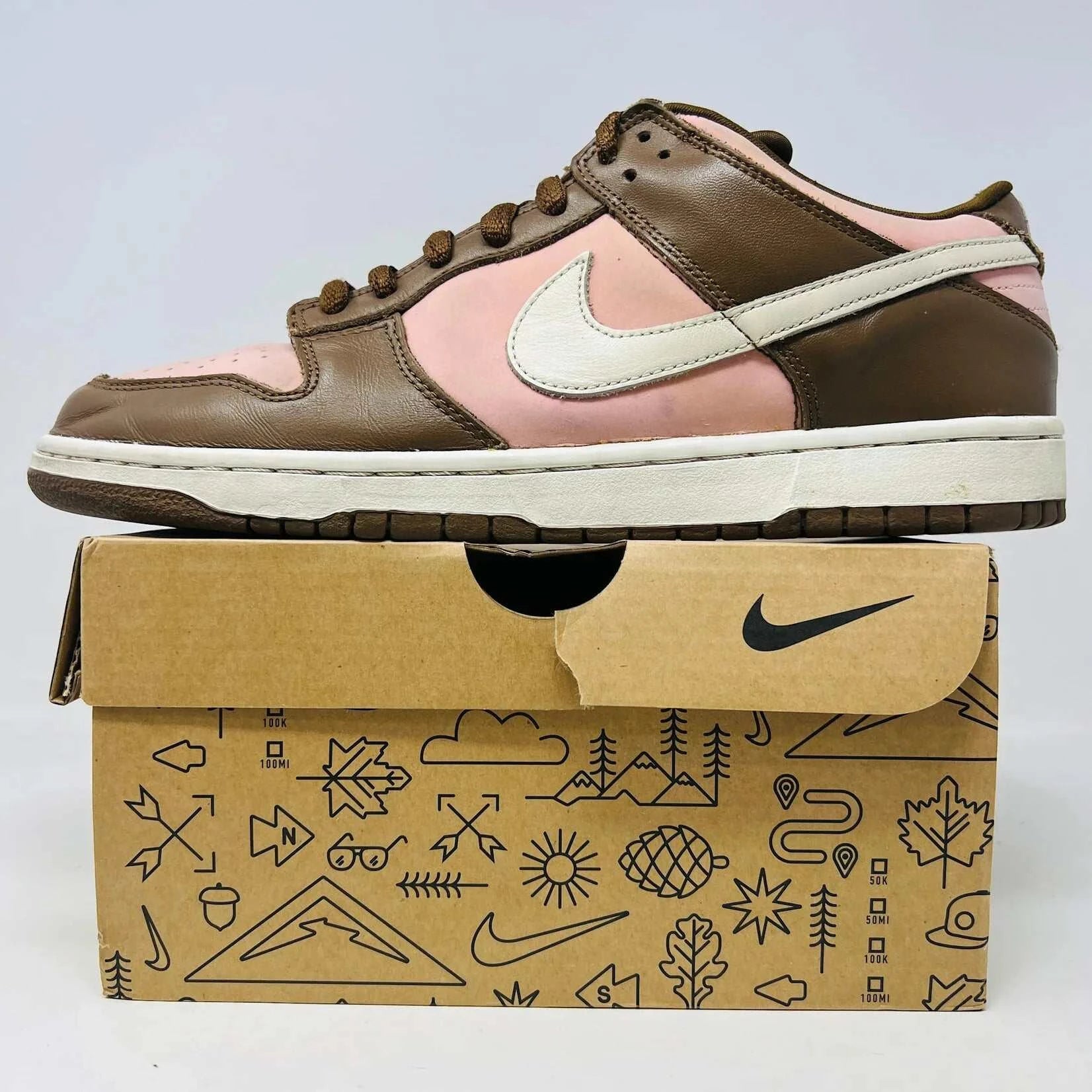 Nike SB Dunk Low Stussy Cherry sneakers on replacement box, brown and pink colorway, 2005.