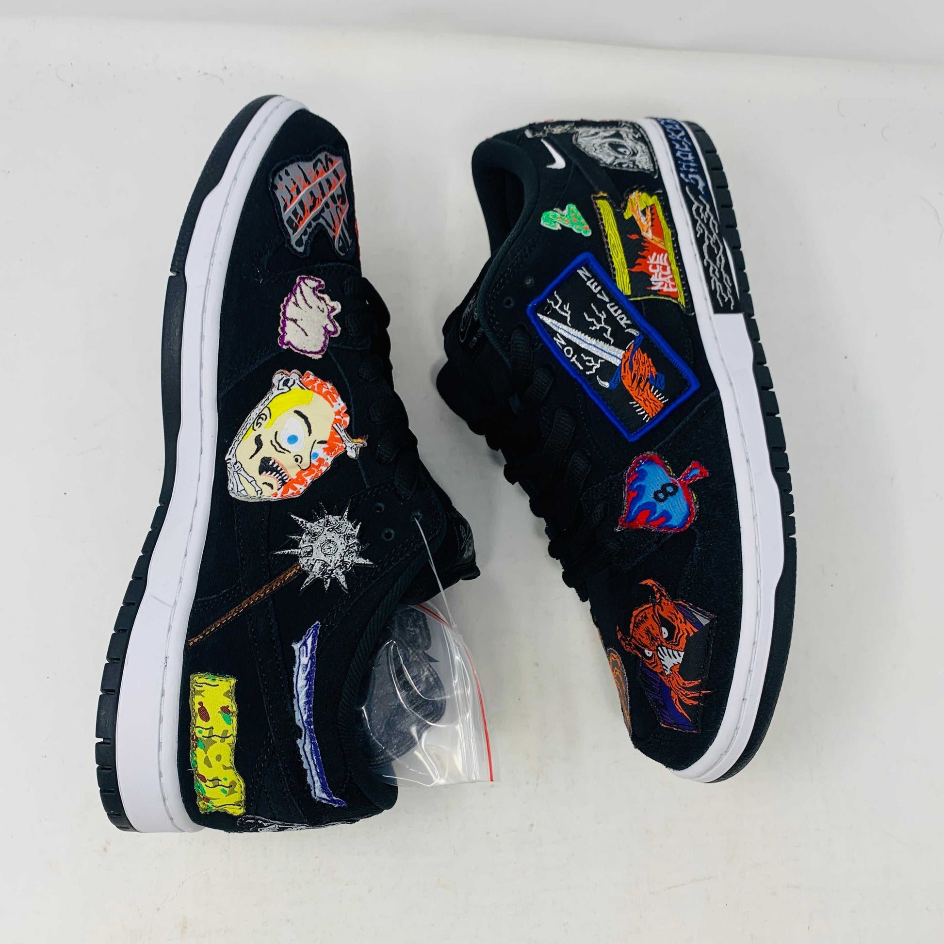 Authentic Nike SB Dunk Low Neckface sneakers, showcasing colorful animal and abstract patches, come in a vibrant green, yellow, and blue Nike SB box on a plain background. All sales final.