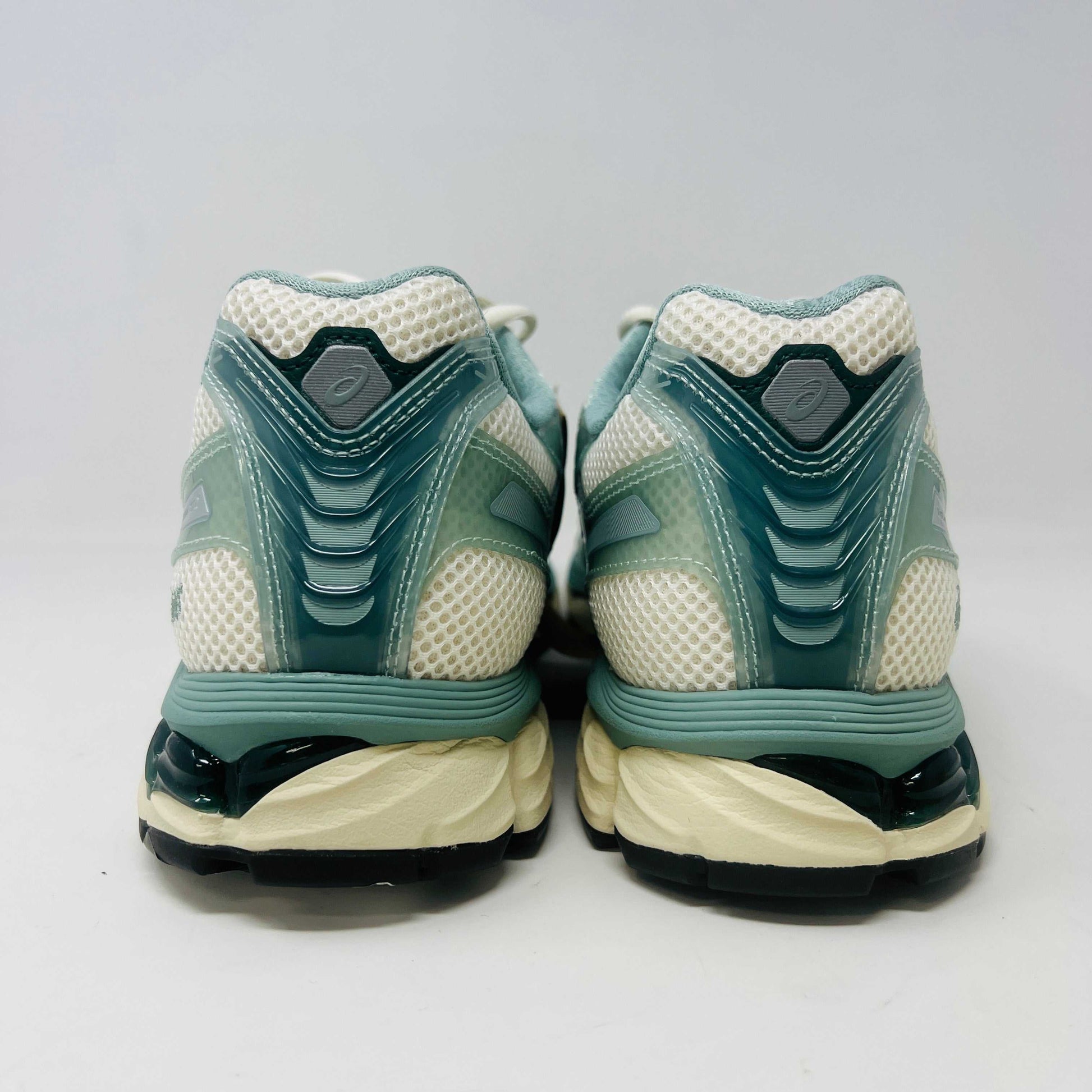 The ASICS Gel-Kayano 12.1 Kith Cream Sage sneakers in pastel green and white feature a breathable mesh design. Theyre accompanied by two packs of extra laces (green and white with black speckles), offering versatile styling for your 100% authentic needs.
