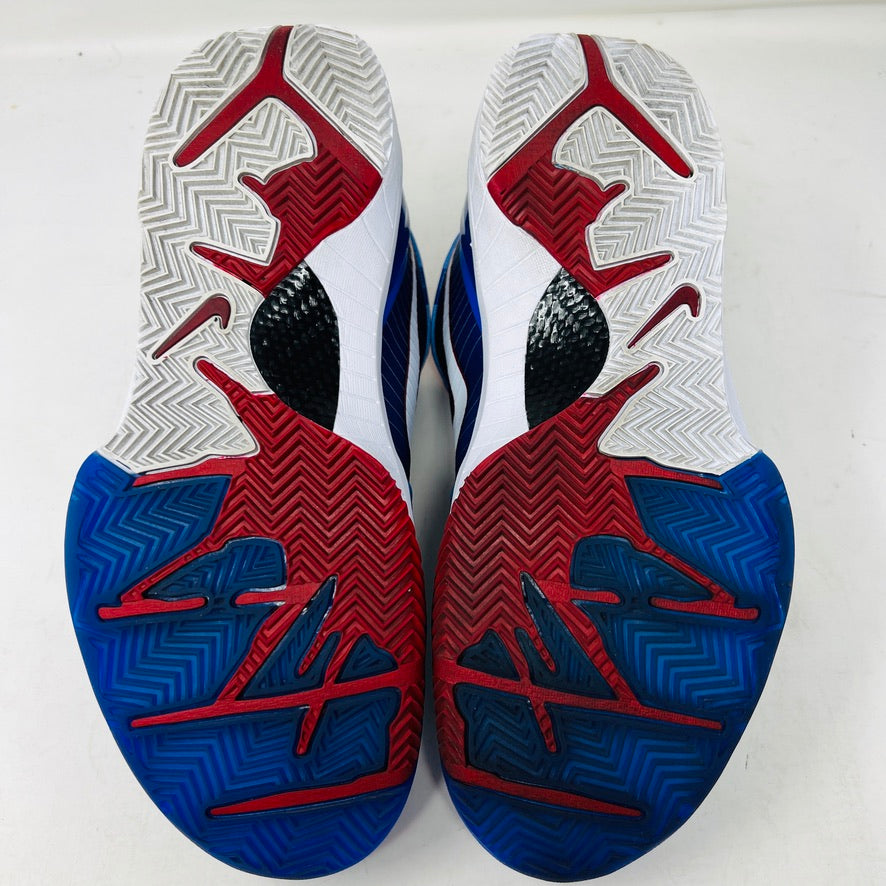 A Nike Kobe 4 Protro Philly (2024) sneaker, blue with red accents and a white swoosh, sits on a black Nike box in excellent condition. Perfect for general wear, it features pinstripes and ZOOMAIR on a white sole. The box shows size and model details.