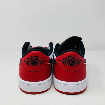 Discover the Jordan 1 Retro Low OG Black Toe (2023) sneakers featuring genuine black and white leather panels, red laces, and soles. These low-tops from Jordan come with extra laces and are displayed on a clean white surface against a pristine background.