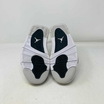 The Jordan 4 Military Black GS sneakers, featuring distinctive side netting and a logo on the tongue, are brand new and authentic in white and gray with black accents. They face forward on a white surface against a plain background, embodying modern style.