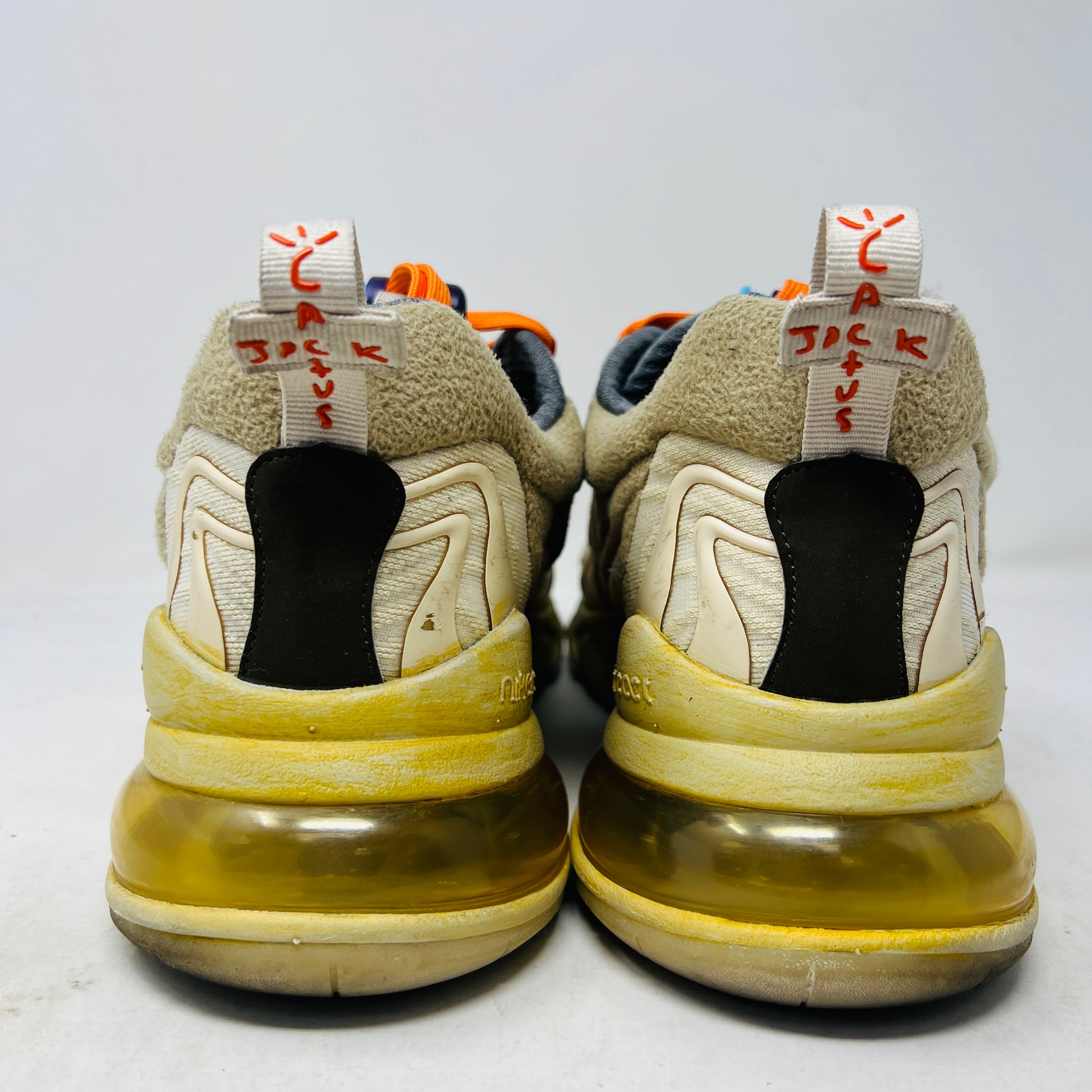 The 2020 Nike Air Max 270 React ENG Travis Scott Cactus Trails features tan, orange, and yellow hues atop its black and red box. It includes a white shoelace as extra laces, with a price tag of $330.