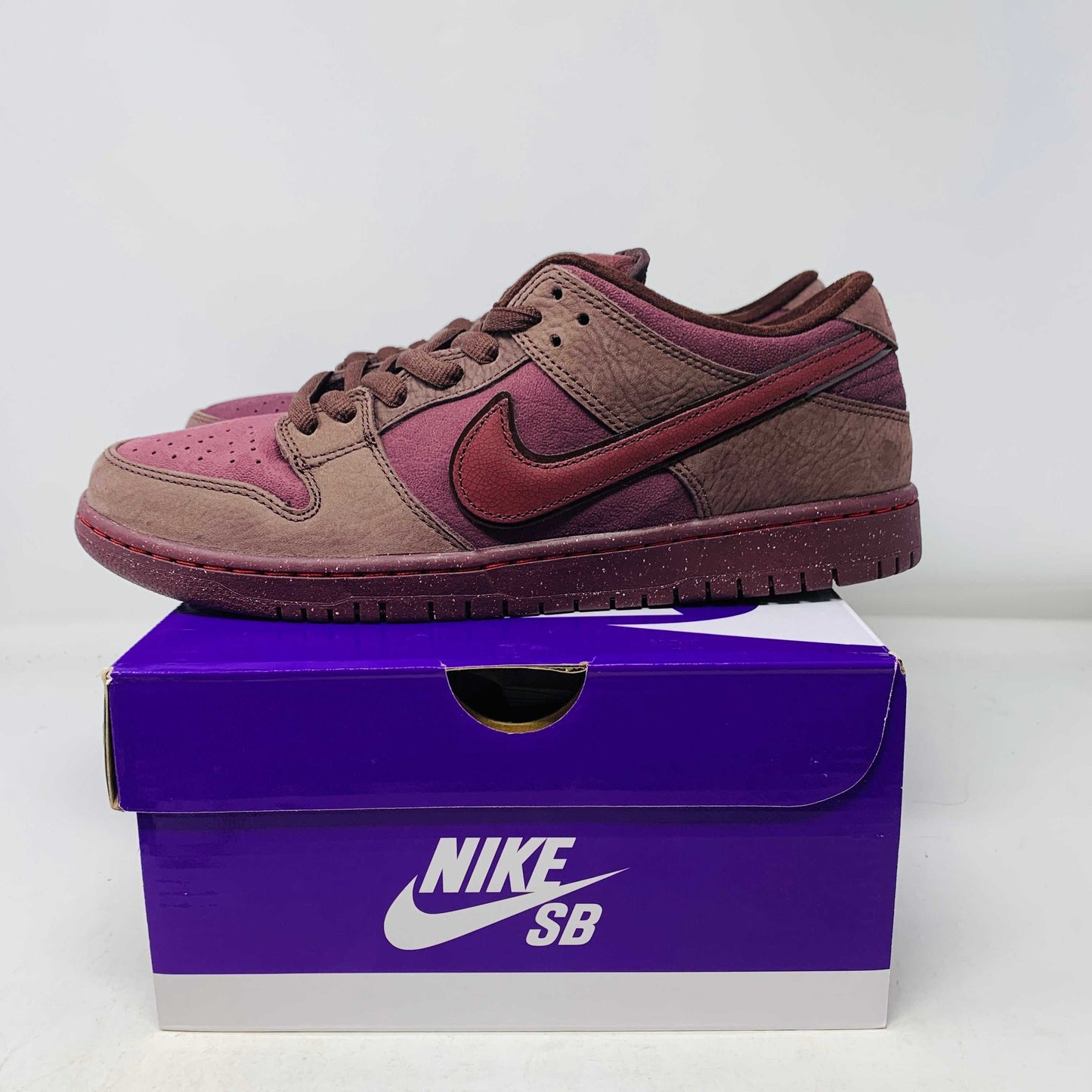 Nike SB Dunk Low City of Love Burgundy Crush sneakers on Nike SB purple box with red laces, 2024 model
