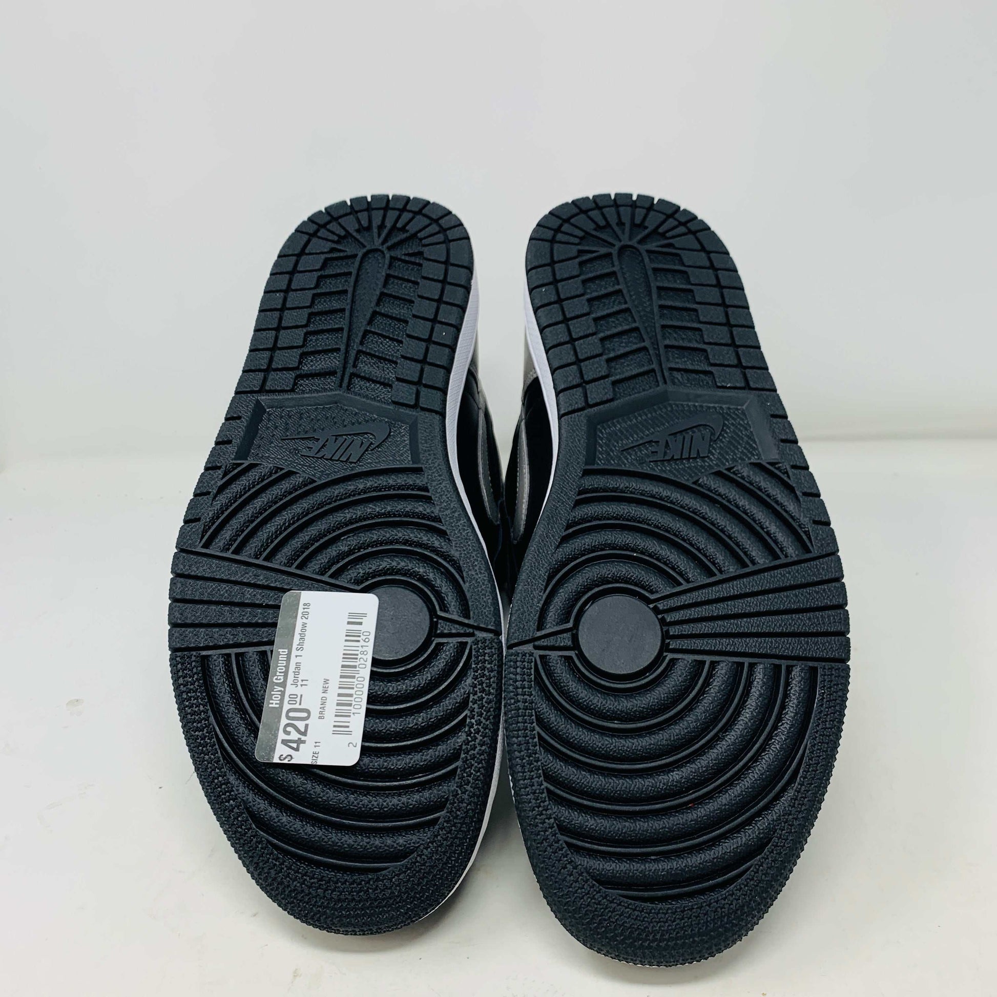 Jordan 1 Shadow 2018 sneakers with grey laces on a Nike box. Brand new condition.