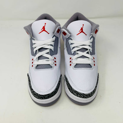 The Jordan 3 Retro Fire Red (2022) (GS) features white, red, and gray colors with elephant-print accents on a black-and-gray patterned box. The box has a red jumping silhouette and bold AIR lettering, making this BRAND NEW release ideal for collectors and enthusiasts.