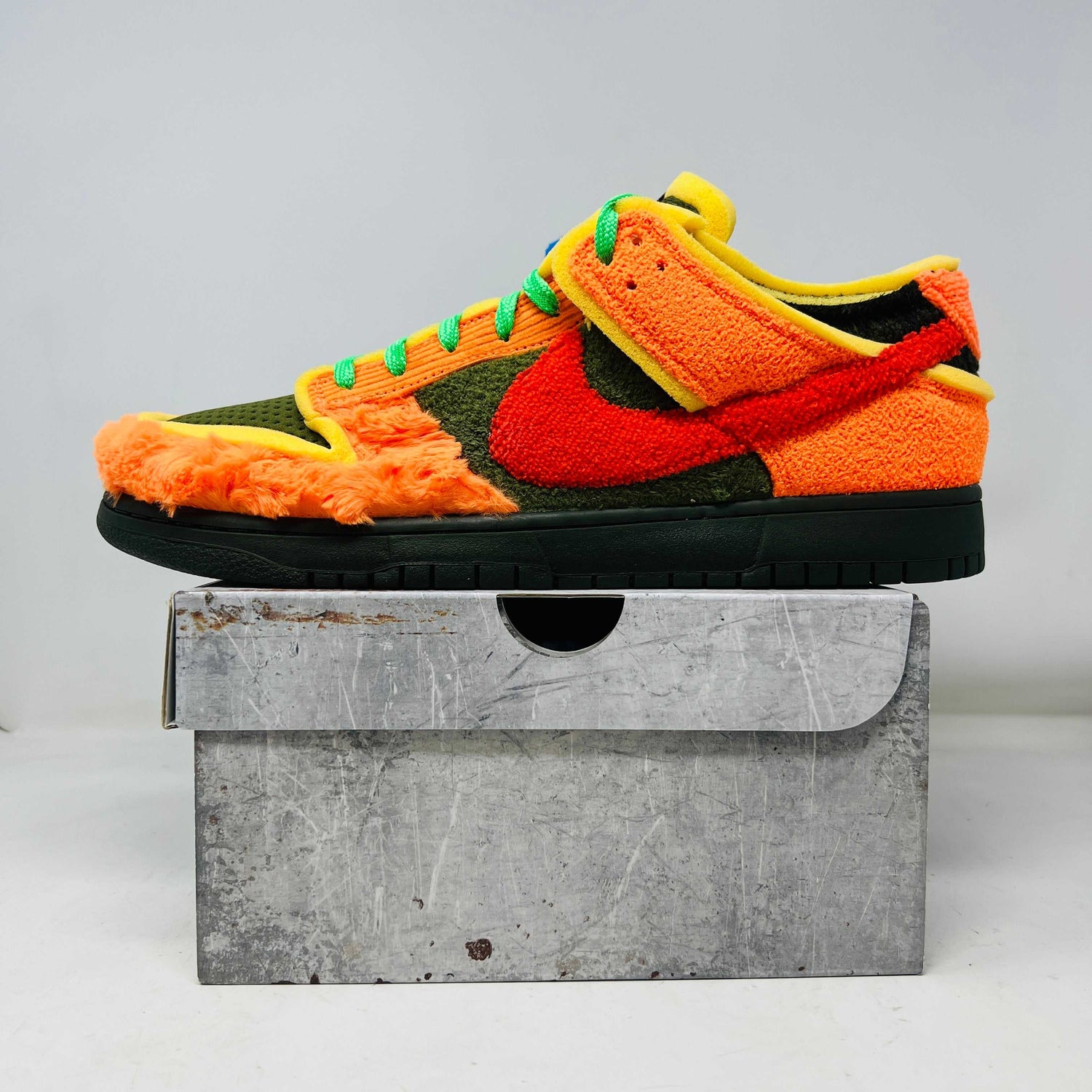 Nike Dunk Low Cactus Plant Flea Market Swamp Sponge Photo Blue with orange furry texture and green accents on gray box