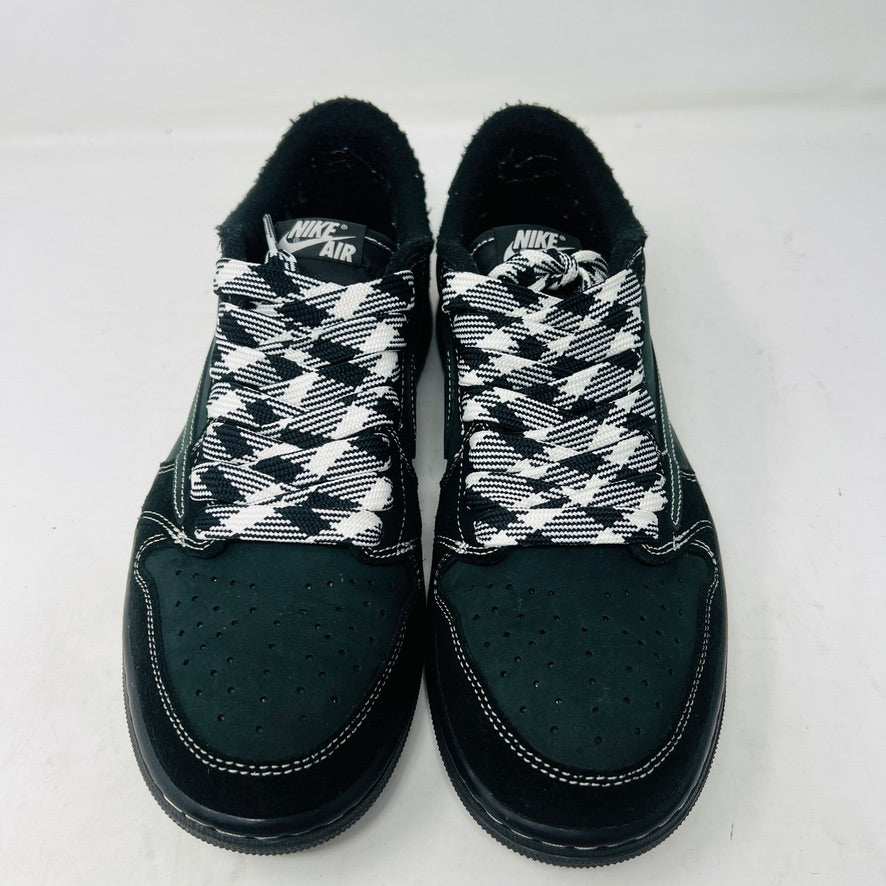 A pair of Jordan 1 Retro Low OG SP Travis Scott Black Phantom sneakers with perforated toe boxes and black and white checkered laces includes extra laces for added style. These authentic Jordans are displayed side by side on a white surface.