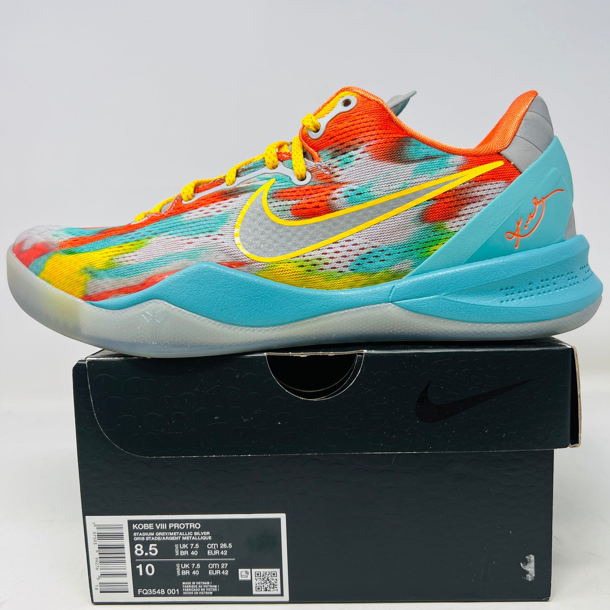 The Nike Kobe 8 Protro Venice Beach (2024) comes in a sleek black box, featuring multicolored abstract patterns in orange, blue, red, and yellow. A crisp yellow swoosh highlights its clean uppers. The shoe size is prominently displayed on the label, ready for normal wear.