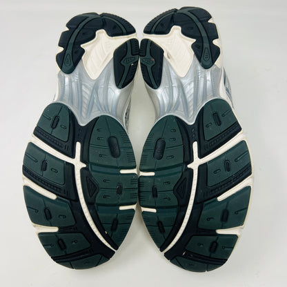 An ASICS GT-2160 Kith Cream Scarab (2023) running shoe with a clean cream and scarab-colored mesh design featuring black accents sits on a brown box. Priced at $350, the box in good condition details sizing and brand logos.