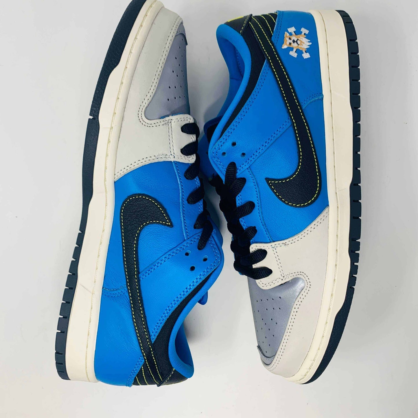 Nike SB Dunk Low Instant Skateboards sneakers with blue and black design.