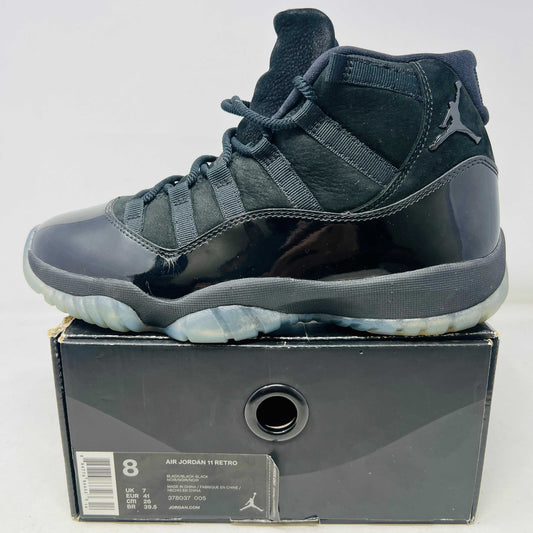 Black Jordan 11 Retro Cap and Gown sneaker on box with clean uppers and good condition box