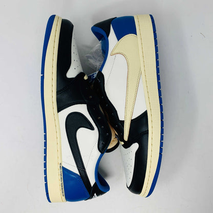 The Jordan 1 Low Travis Scott x Fragment sneakers feature a black and white leather upper with blue accents, a unique beige backward swoosh, and come in a branded Nike box with graphics. These brand-new shoes include an extra set of laces for added versatility.