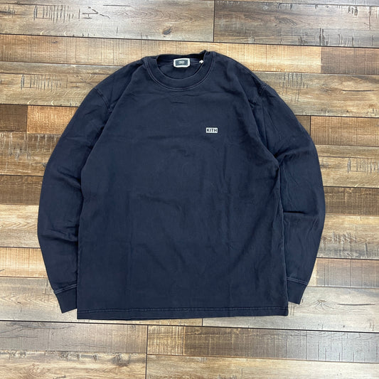 Preowned Kith LAX long sleeve tee in asteroid color laid flat on wooden floor