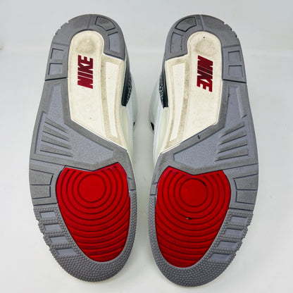 The Jordan 3 Retro White Cement Reimagined features white uppers with gray elephant print and red details, displayed on a black Nike Air shoebox. The size on the box reads 11, and the sneakers are pristine, free from heel drag.