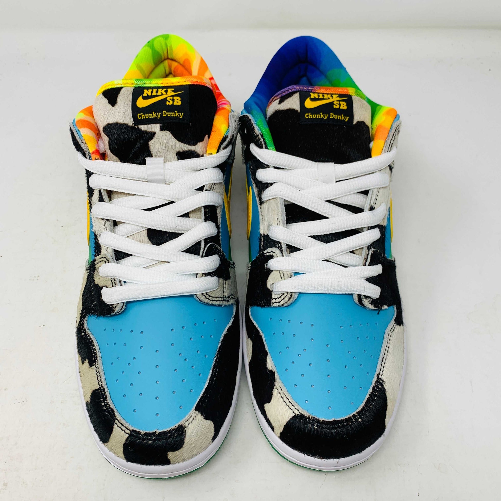 Introducing the new Nike SB Dunk Low Chunky Dunky with a vibrant cow print, featuring blue, green, and yellow sections. This 100% authentic sneaker includes a yellow swoosh and comes in a matching green and yellow box with extra laces, all from Nike.