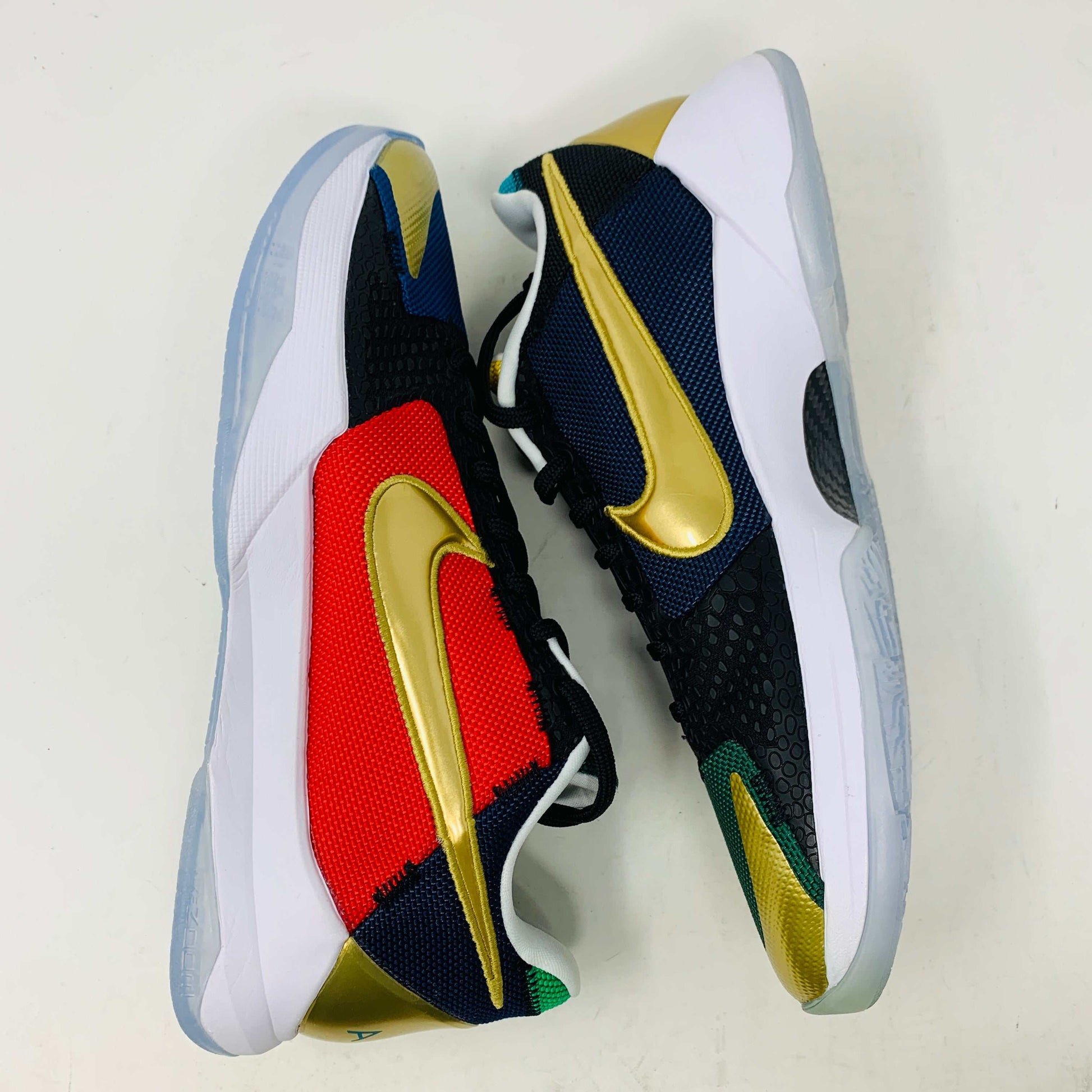 Kobe V Protro Undefeated Pack sneaker with black, gold, purple, and red colorways, featuring premium materials and Protro technology.