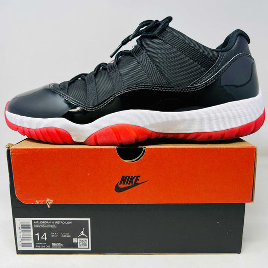 Jordan 11 Retro Low Bred sneaker in black and red on Nike box, size 14, 2025 model