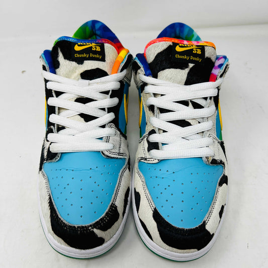 The Nike SB Dunk Low Ben & Jerrys Chunky Dunky sneakers feature a vibrant cow-patterned design with a yellow swoosh. Presented in a matching box, they come with green and yellow extra laces. Their clean uppers enhance the style while durable materials minimize toe box creasing.