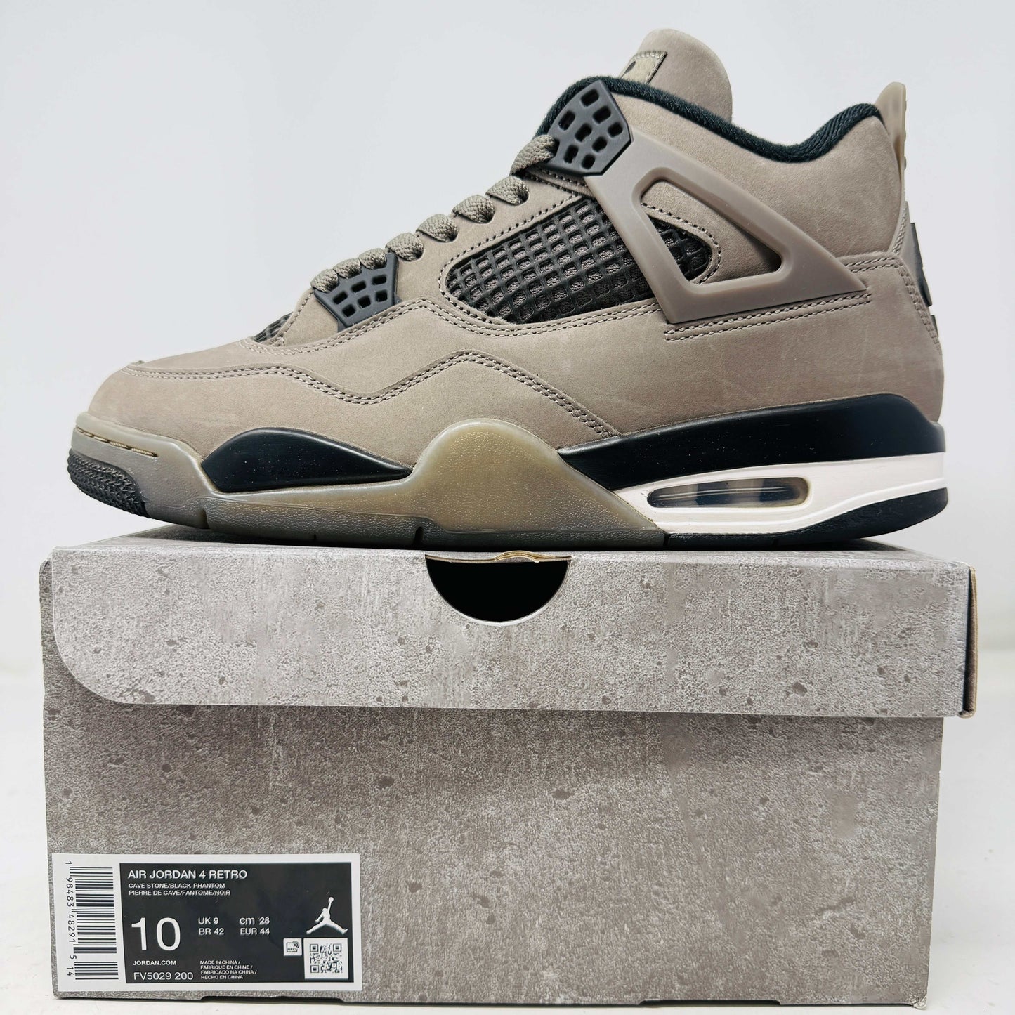 Jordan 4 Retro Cave Stone sneaker in taupe color with black accents on box