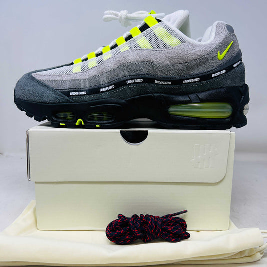Nike Air Max 95 SP Undefeated Geo NYC Neon sneaker in grey with neon accents on white box