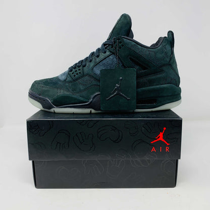 Jordan 4 Retro Kaws Black sneaker on original box with KAWS-inspired design and logo tag