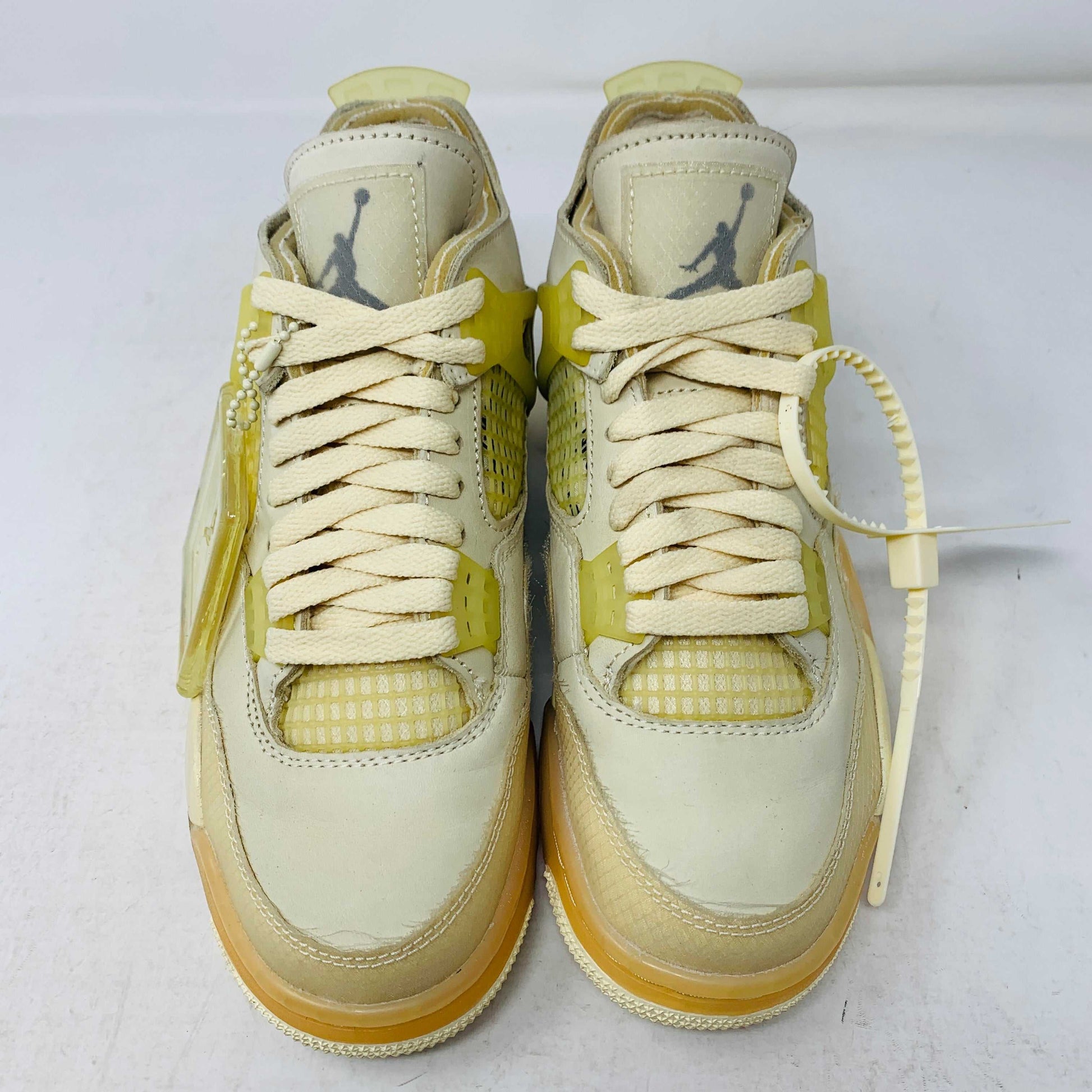 Jordan 4 Retro Off-White Sail Women's sneakers, size 5.5W/4M, 2020 model with yellowing, cream laces, hangtag, and zip tie.