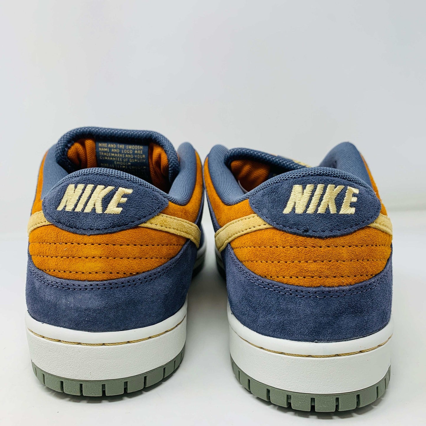 Nike SB Dunk Low Light Carbon Monarch sneakers, rear view, brand new condition, 2024 release.