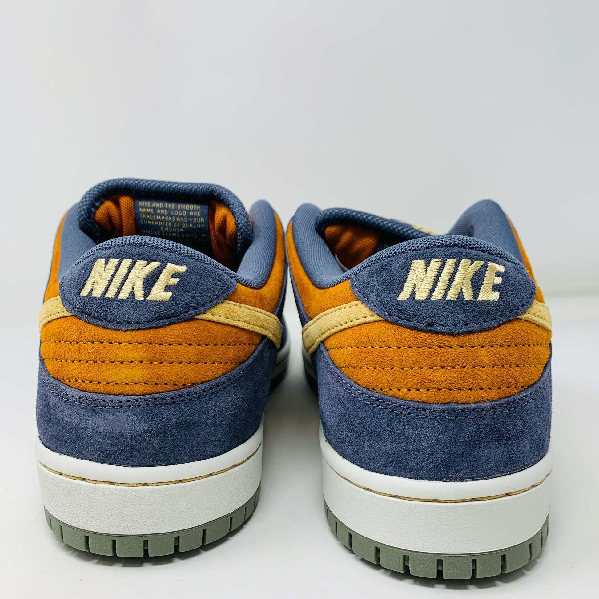 Nike SB Dunk Low Light Carbon Monarch sneakers, rear view, brand new condition, 2024 release.