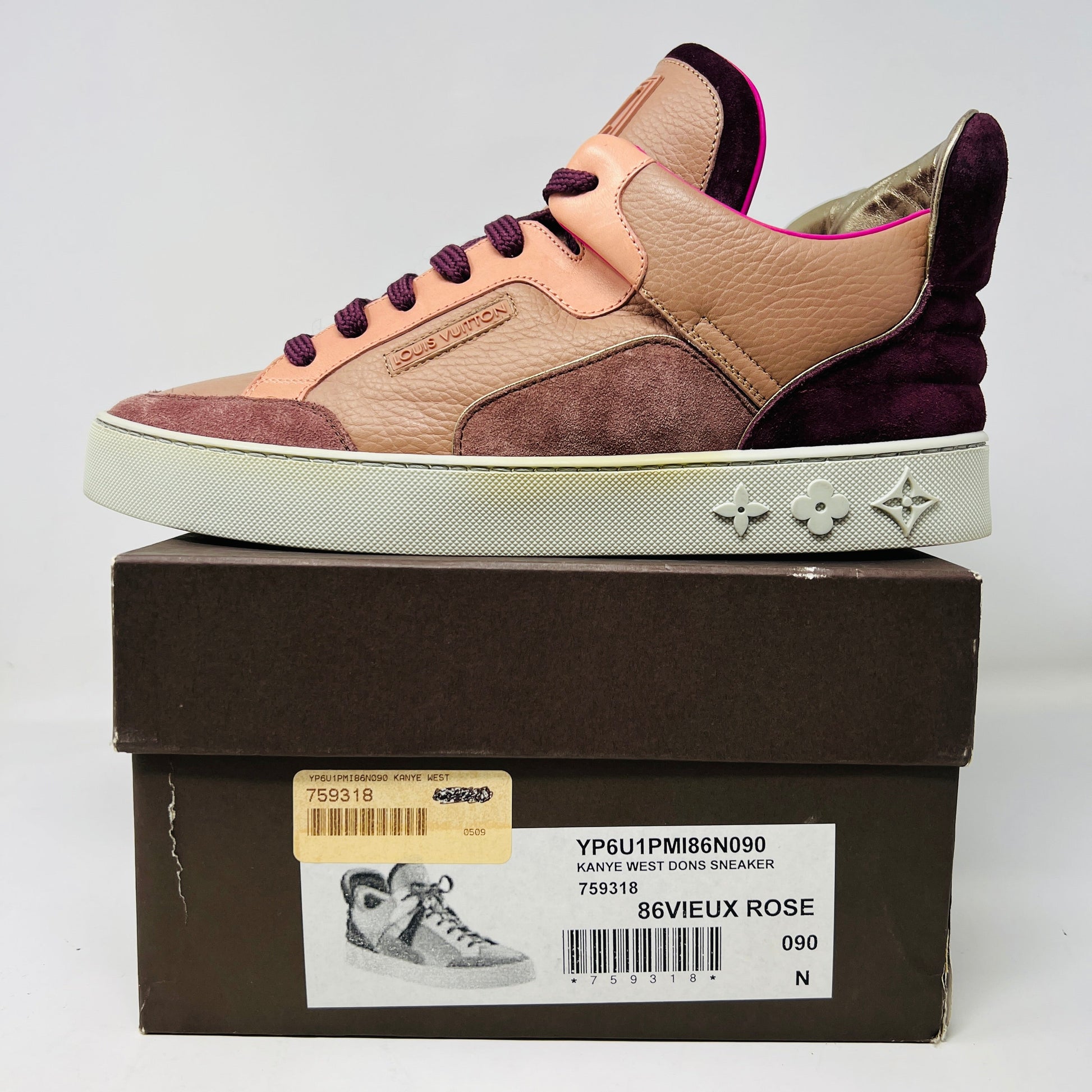 A stylish sneaker on a box labeled Louis Vuitton Don Kanye Patchwork features a 2009 design, echoing Louis Vuittons flair with pink and brown textured leather, and a logo-patterned sole. The accompanying box includes a product label with barcode and details from Louis Vuitton.