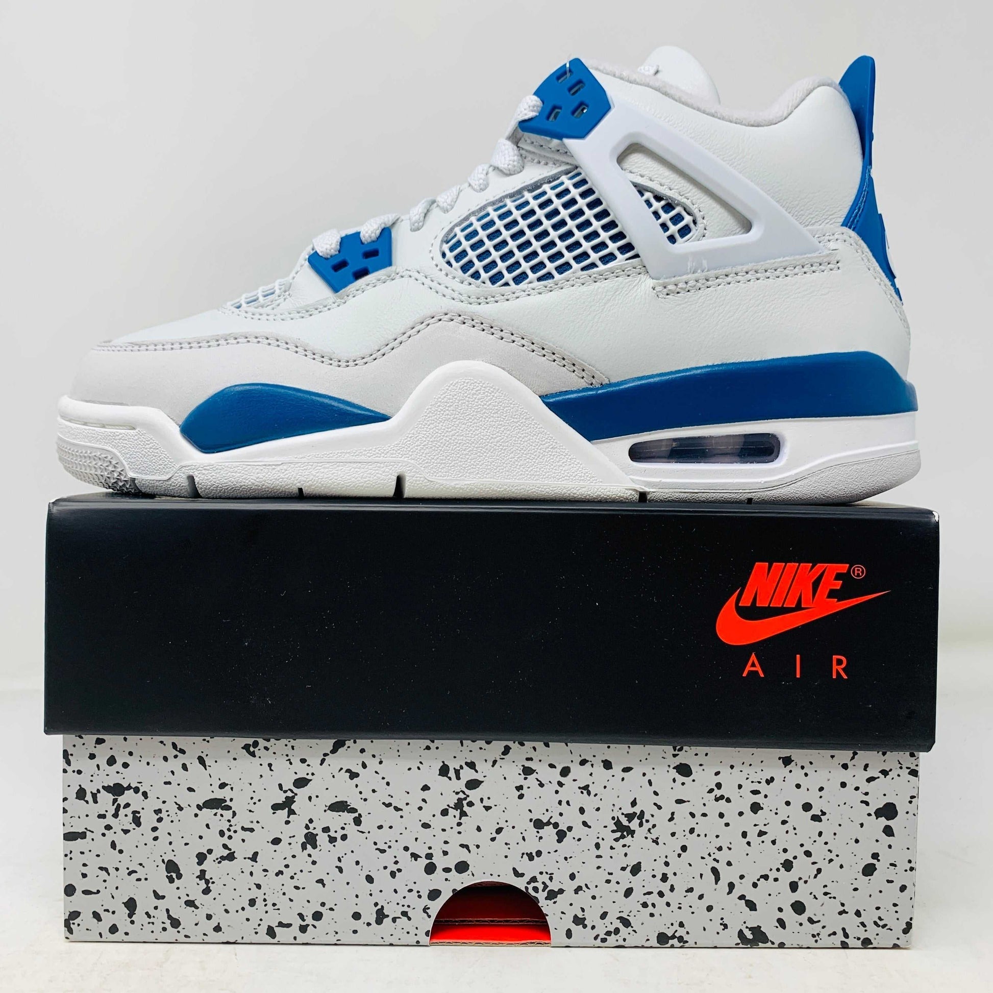 Jordan 4 Retro Military Blue 2024 GS sneakers on box with hangtag.