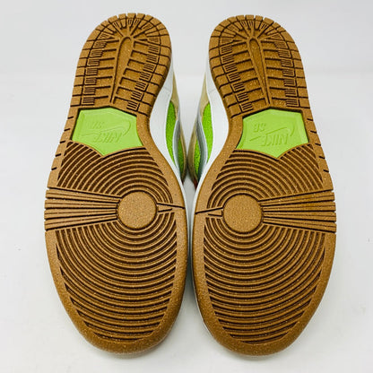 Nike SB Dunk Low Escargot shoes 2024 with green accents and brown soles shown from the bottom.