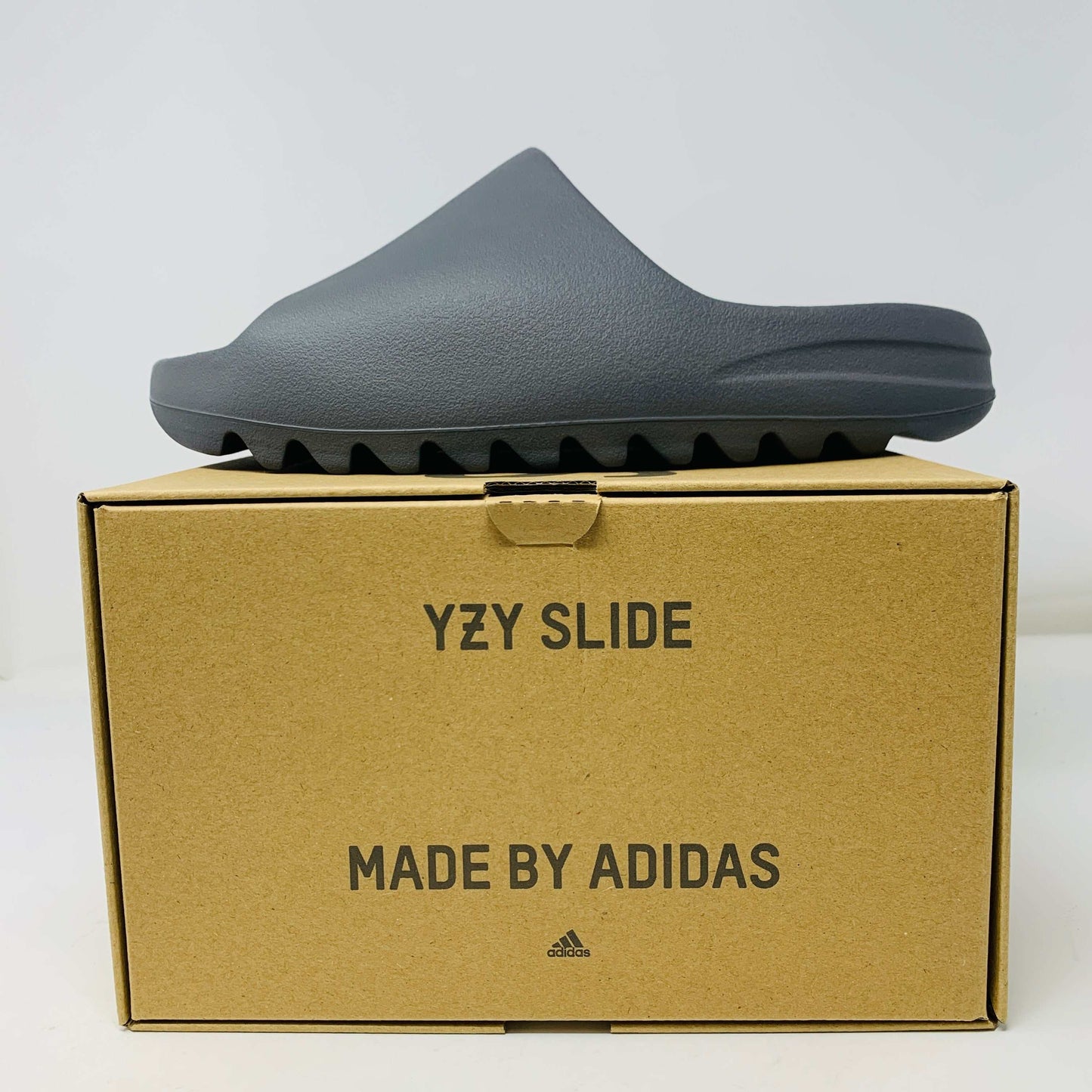 Adidas Yeezy Slide Granite 2023 in brand new condition, displayed on original box.