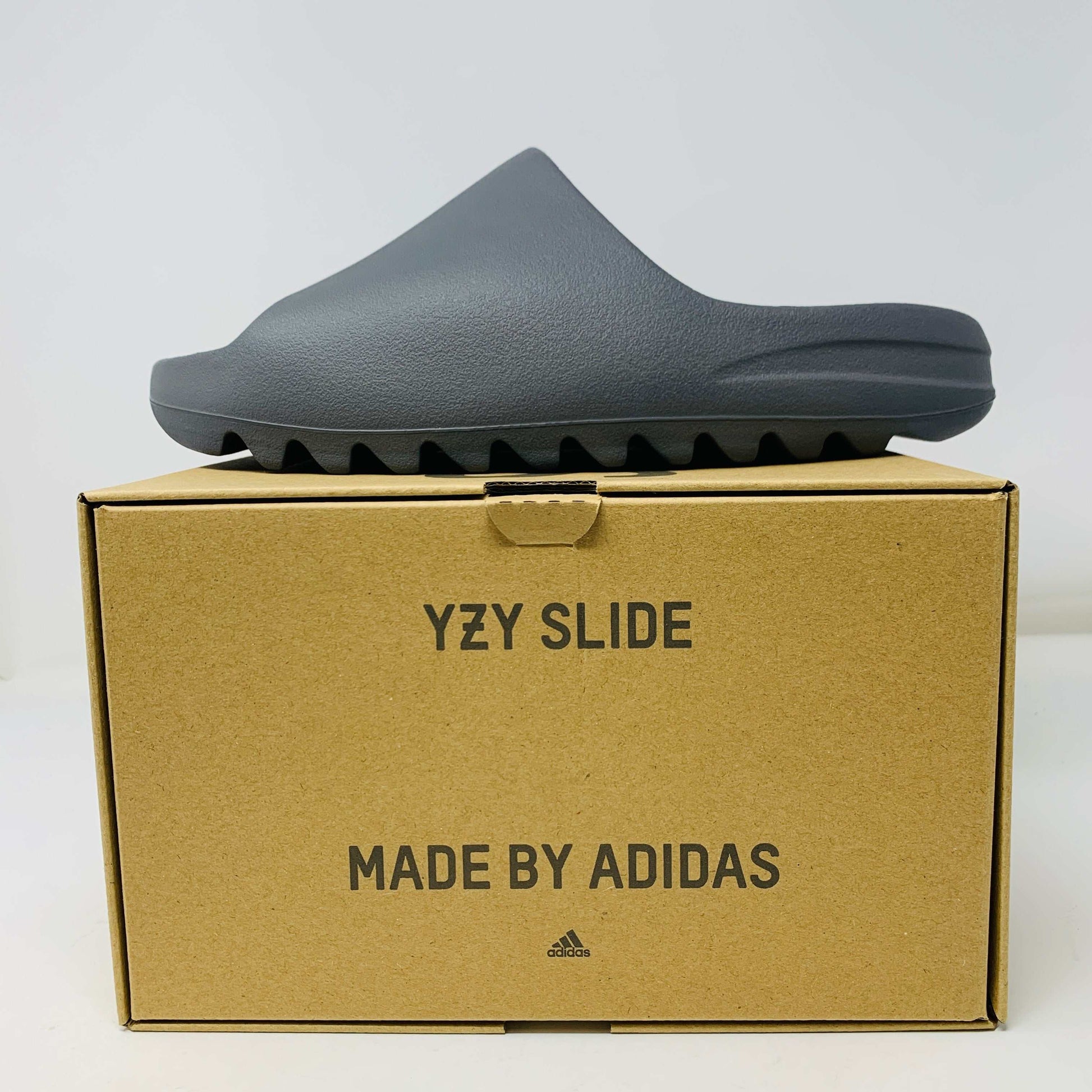 Adidas Yeezy Slide Granite 2023 in brand new condition, displayed on original box.