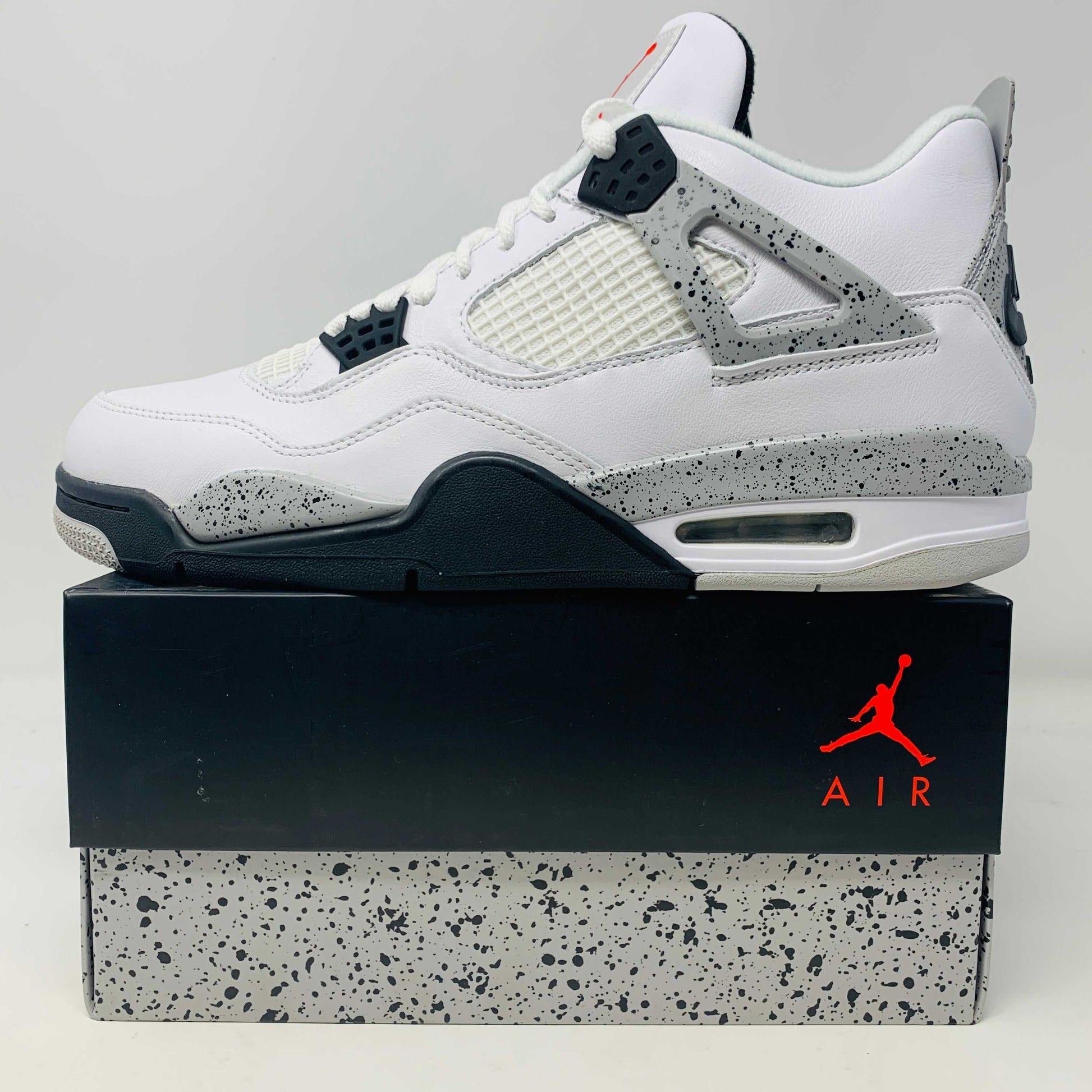 Jordan 4 White Cement 2016 sneakers, brand new condition, with Jordan hang tag, displayed on original box.