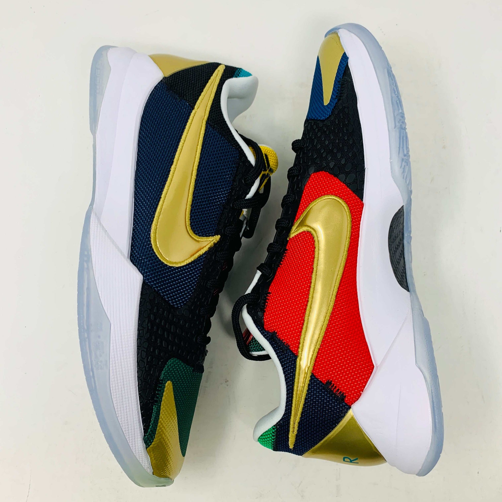 Kobe V Protro Undefeated Pack sneakers in black, gold, purple colorways.