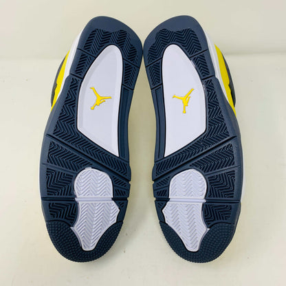 Jordan 4 Lightning sneakers with yellow and black colorway and unique lightning bolt accents.