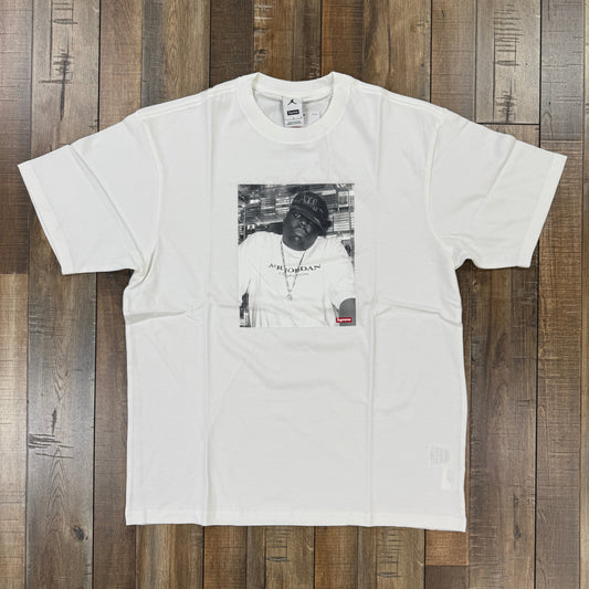 White Supreme Jordan Biggie short sleeve T-shirt with graphic print on wooden floor