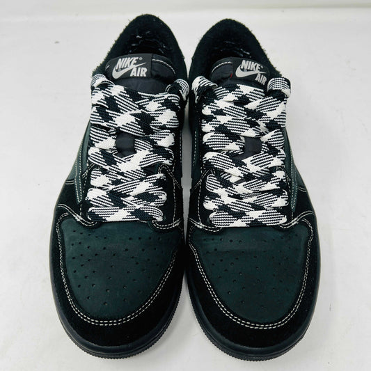 A side view of the Jordan 1 Retro Low OG SP Travis Scott Black Phantom sneaker in black and dark gray with white stitching, size 9.5, displayed on a box with clean uppers and extra laces. A blue sticker shows A2301, with the box label priced at $945.