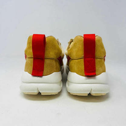 The NikeCraft Mars Yard Shoe 2.0 by Tom Sachs Space Camp features white mesh, tan suede accents, red Nike logos on the tongues, red heel pull tabs, and white laces. This 100% authentic sneaker is perfect for elevating any outfit with style.