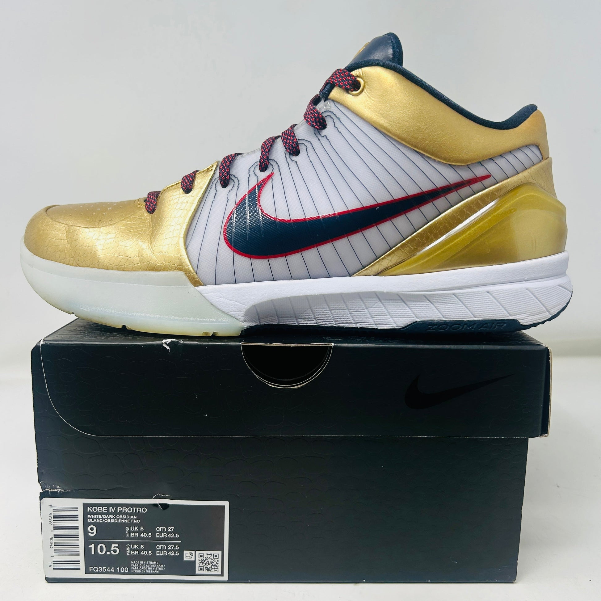 Nike Kobe 4 Protro Gold Medal 2024 sneaker in gold with red and blue accents on black box.