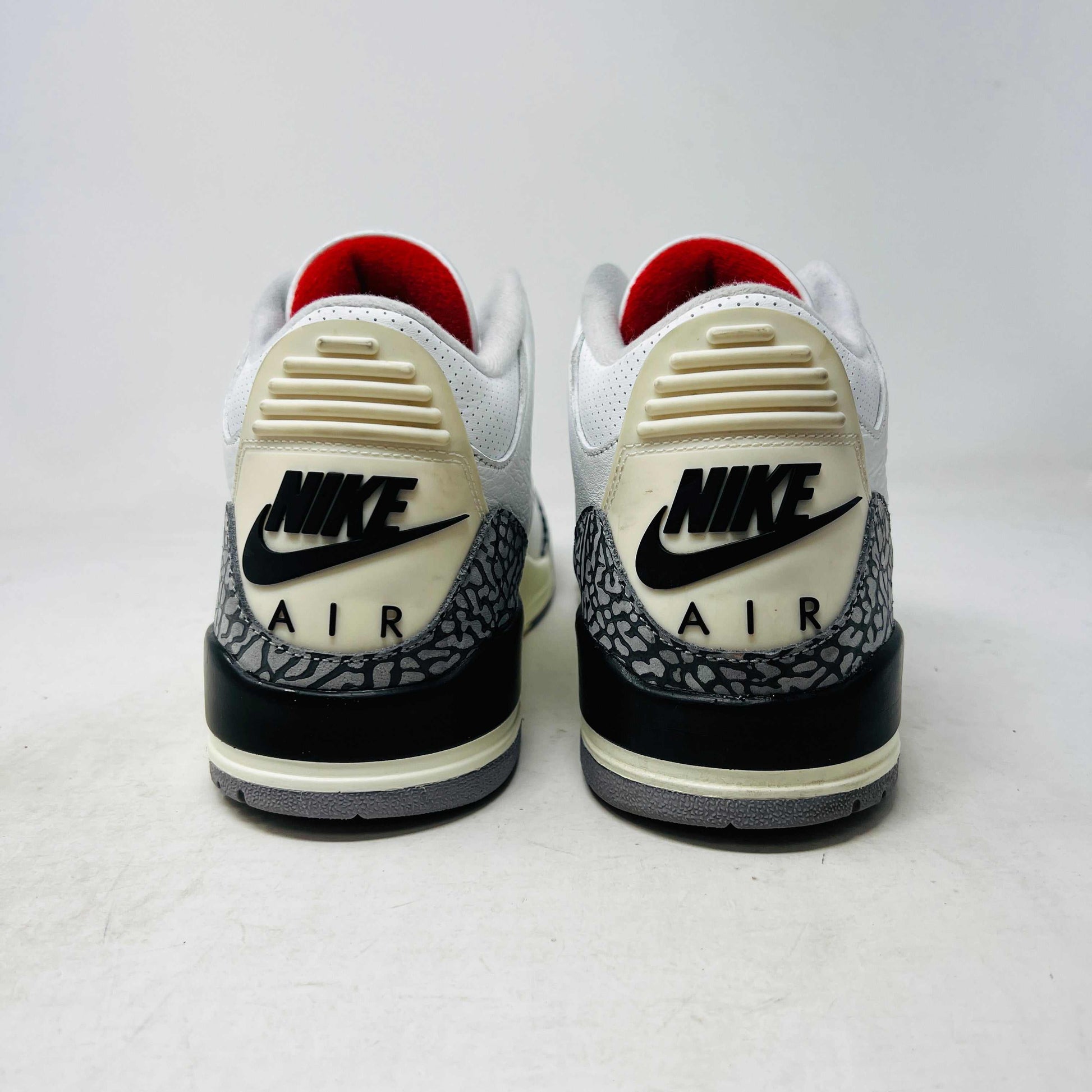 Jordan 3 Retro White Cement Reimagined sneaker on Nike box, 2023 release.