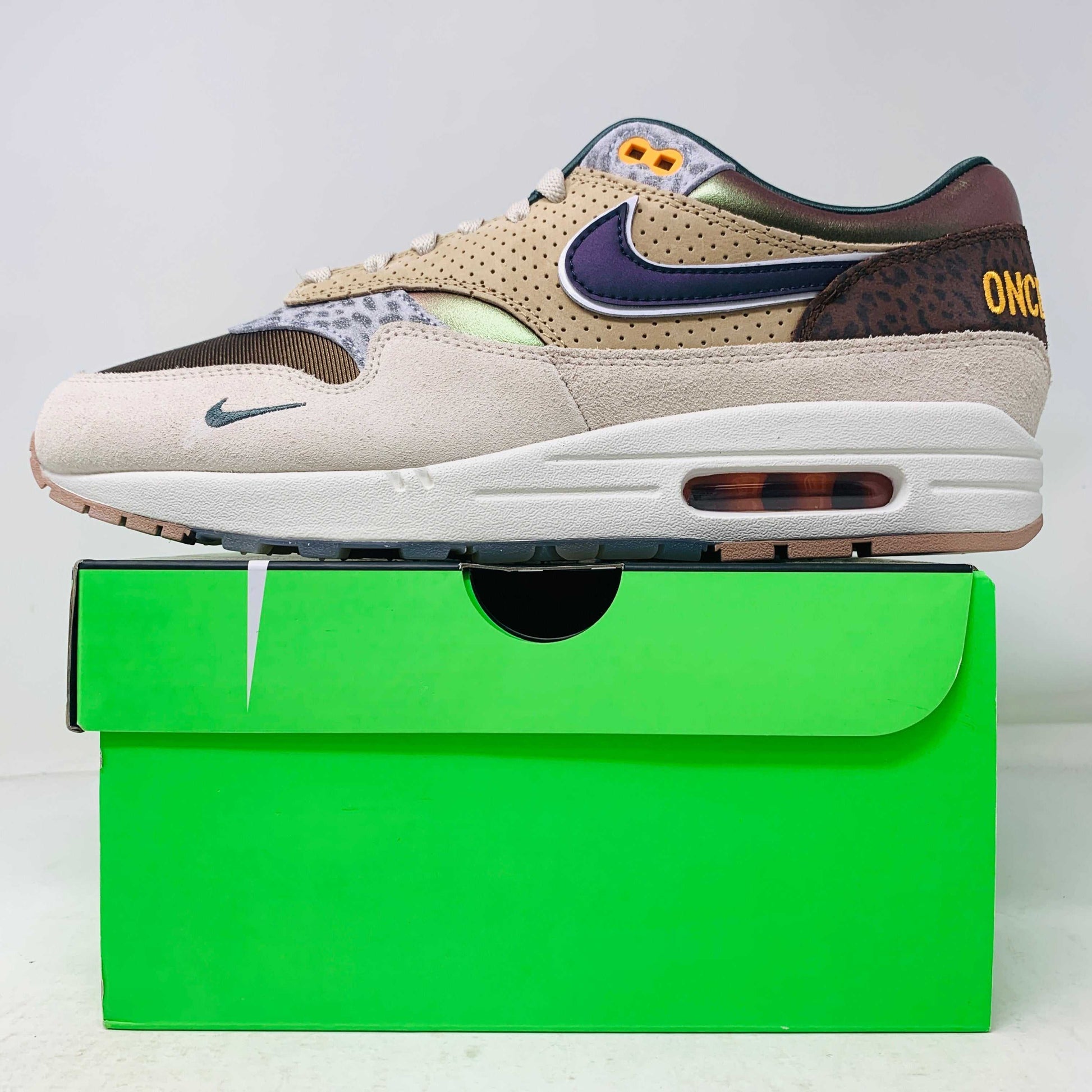Nike Air Max 1 '87 Premium University of Oregon PE 2024 sneaker, brand new condition, displayed on a green shoe box.