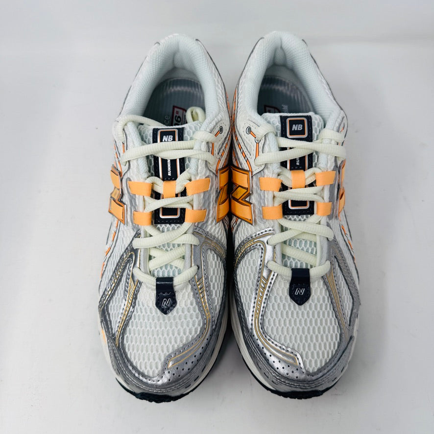 New Balance 1906R ASOS Exclusive Neon Pack in orange on display box.
