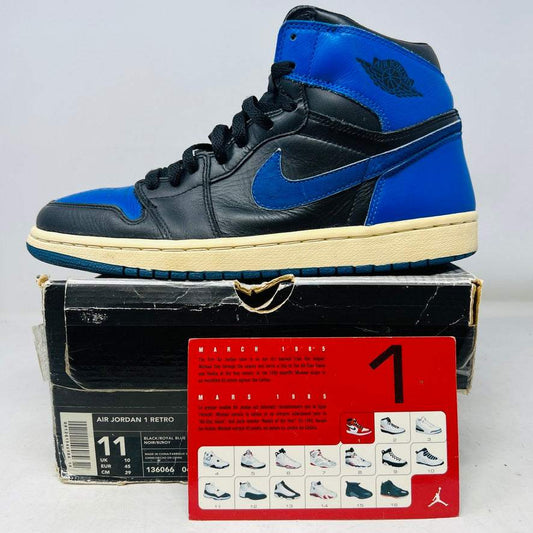 Jordan 1 Retro Black Royal Blue sneaker 2001 on worn box with card