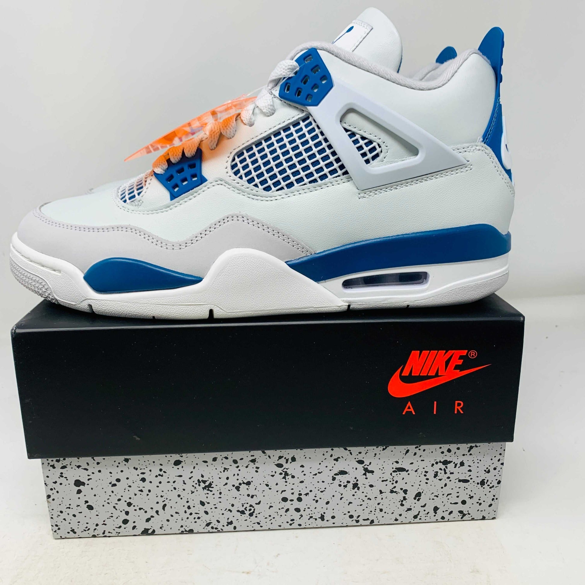 Jordan 4 Retro Military Blue 2024 sneakers, brand new condition, displayed on a box.